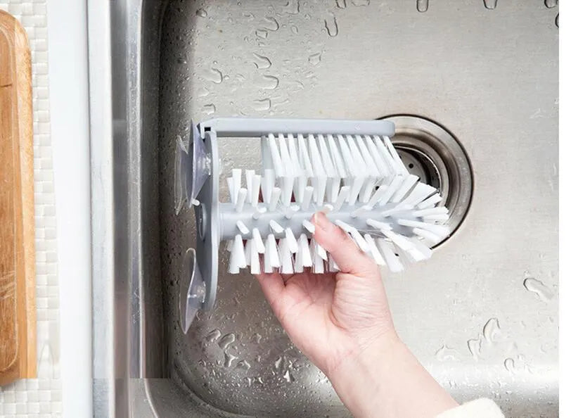 Grey rotating cup brush with suction cups for wall mounting and double cleaning heads