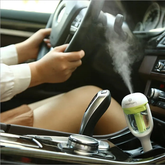 Compact portable car humidifier in blue, green, pink or purple with 180-degree rotation spray head