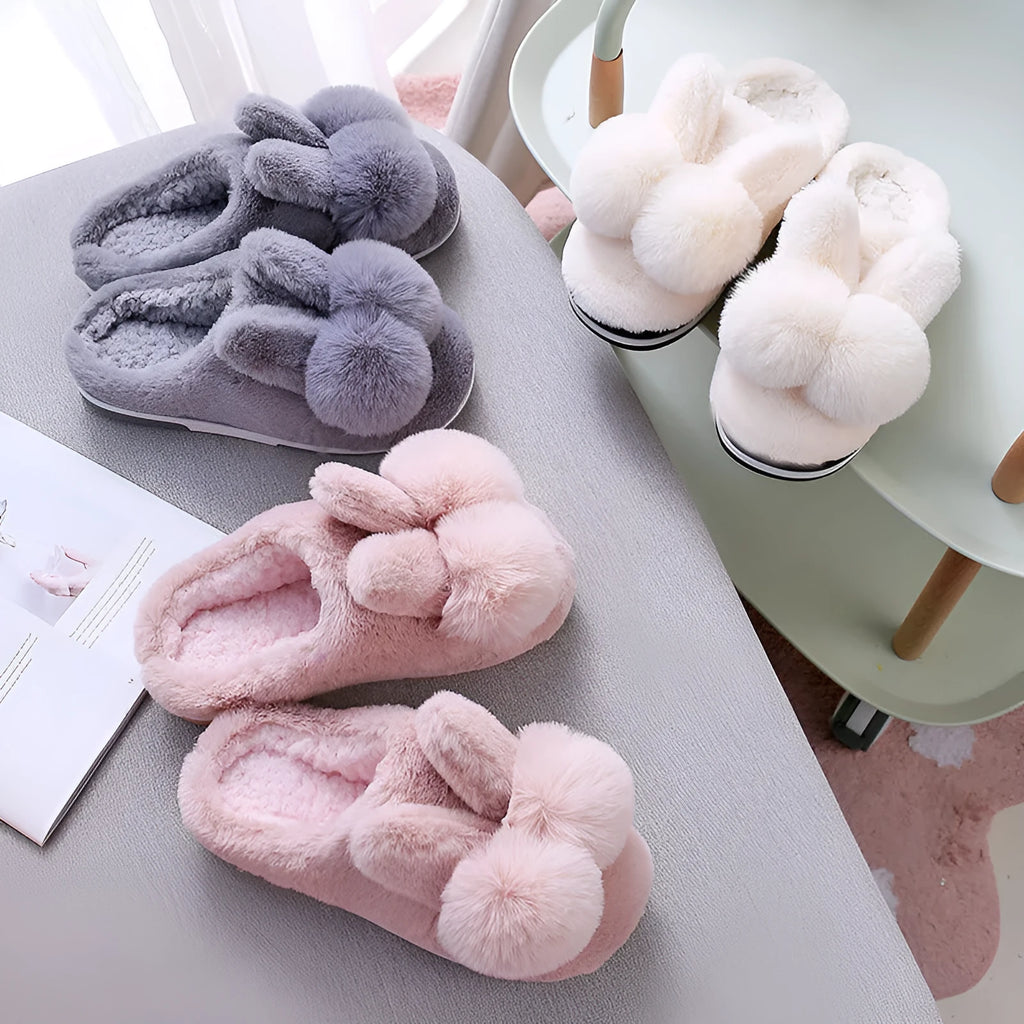 Women's high-top rabbit fur slipper in creamy white with floral detail and low heel.