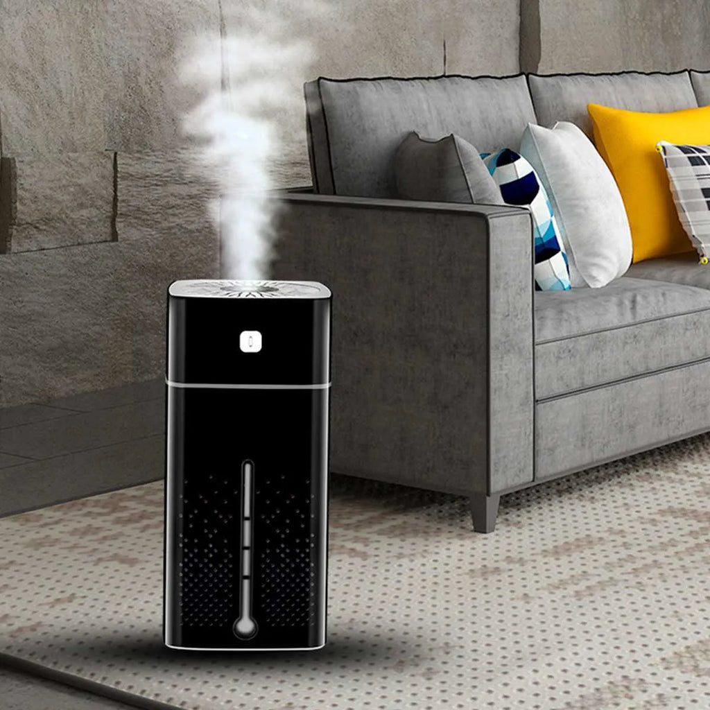 Black and white USB desktop humidifier with 1000ml water tank on a desk.