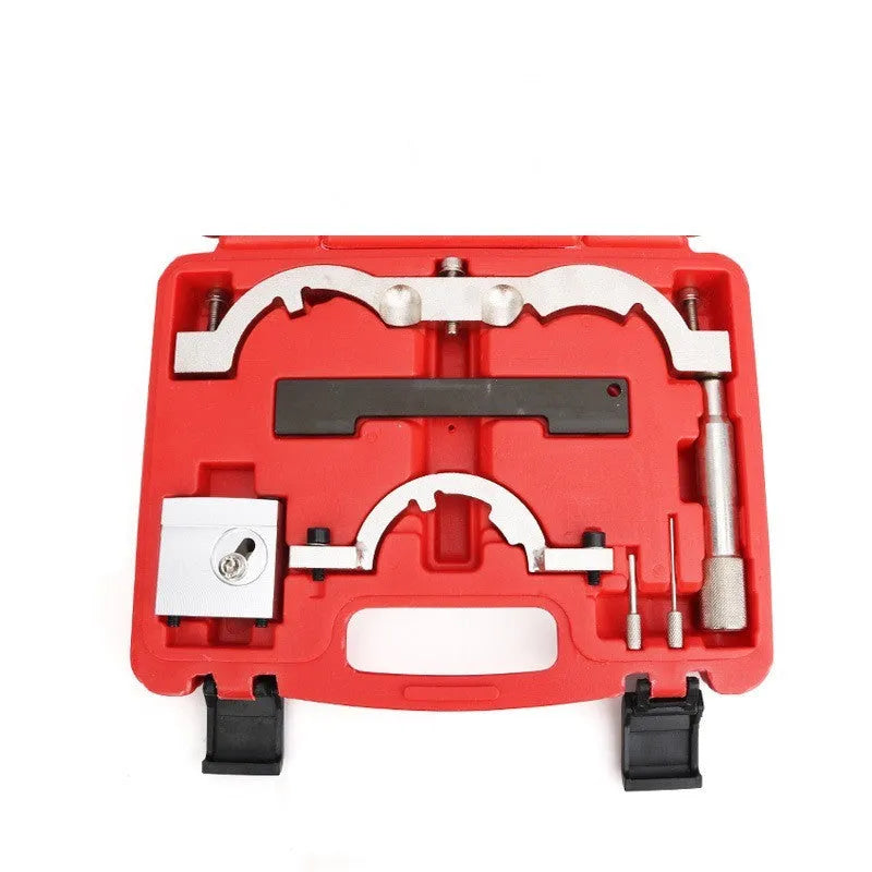 Red chrome-vanadium steel timing tool kit for Opel 1.4T LUJ engine on a workshop bench.