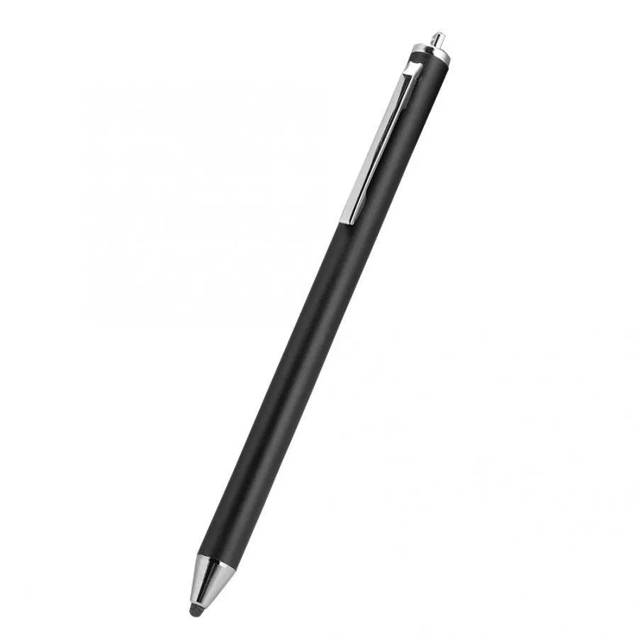 A black metal stylus with a fine point tip positioned next to a mobile phone and tablet on a desk.