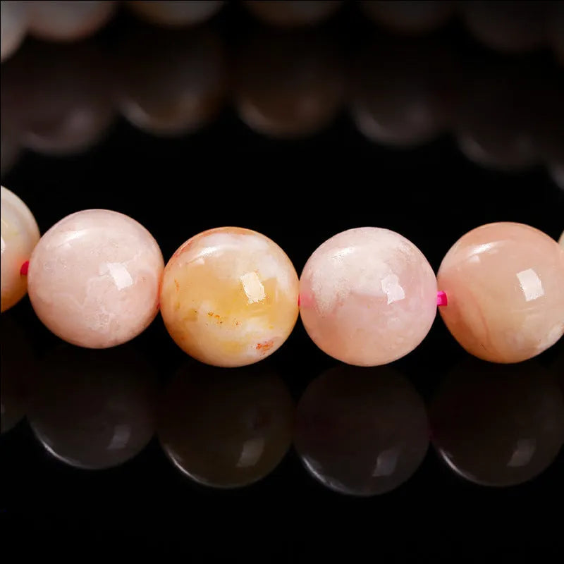 Natural cherry agate bracelet in 3A cherry blossom colour with geometric round shapes