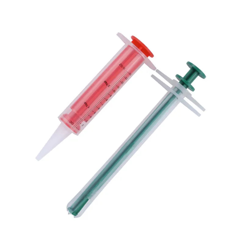 Two pet pill shooters with soft silicone tips for administering tablets to cats and dogs
