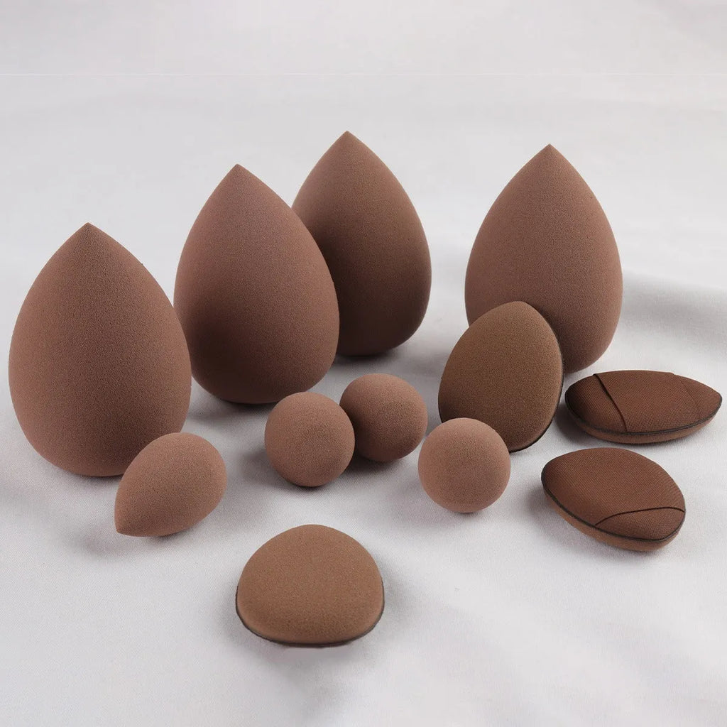 40-piece makeup tool set with beauty blender sponges and soft sponge puffs in coffee brown, pink, and purple