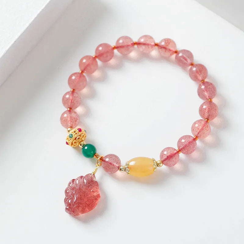 Women's crystal bracelet with polished strawberry quartz beads in nine tail fox colour design