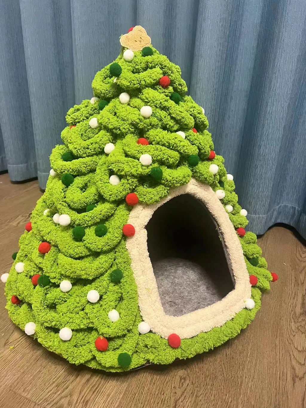 Grey handmade felt cone-shaped cat house with Christmas theme, showing enclosed tent-style design.