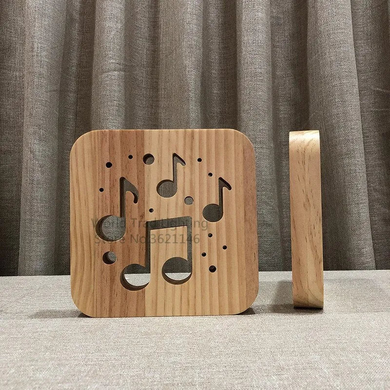 Square pine wood USB lamp with warm white LED glow, showing natural grain texture on a desk.