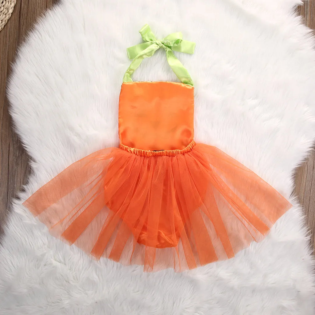 Children's orange Halloween gauze jumpsuit with cartoon dot pattern and voluminous pleated skirt on a white background