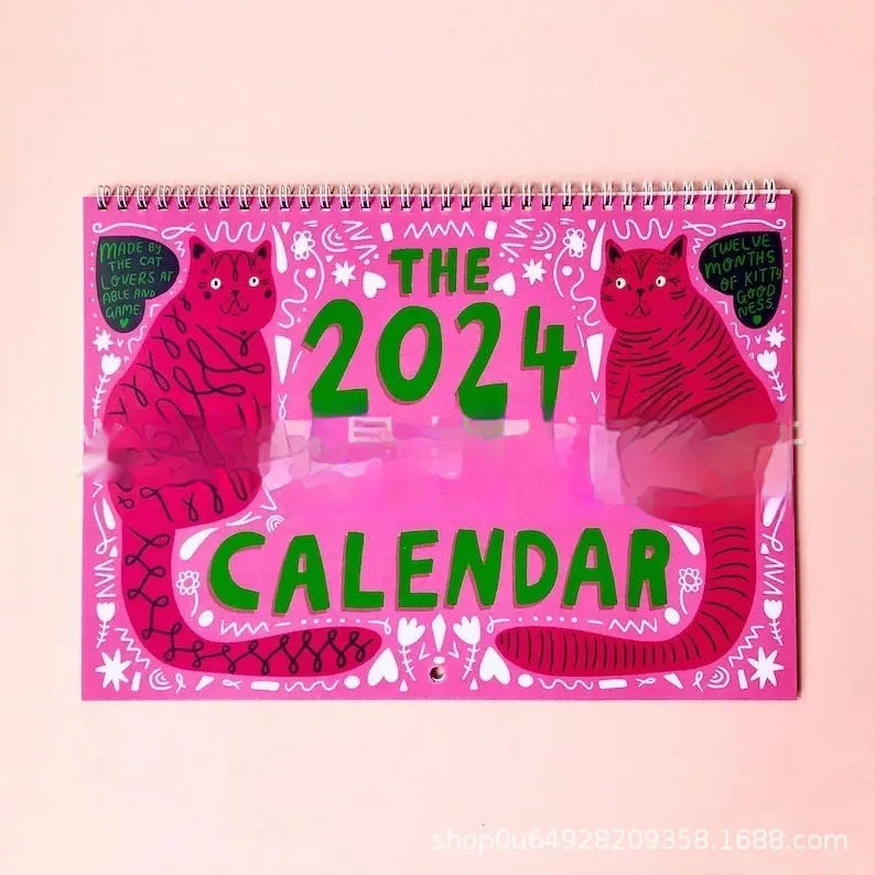 Large A3 cat-themed paper wall calendar for 2024 or 2025 displayed on a wall.