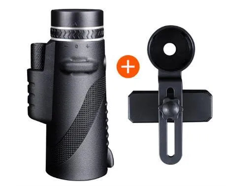 Black 40x60 monocular telescope with mobile phone attachment for photography on a table.