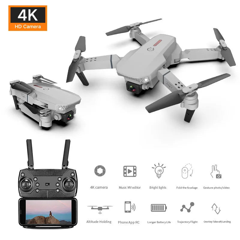 Grey foldable 4K dual camera drone with remote control, spare blades, and charging cable on a neutral background.
