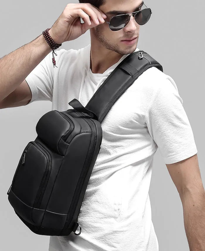 Black medium outdoor leisure shoulder bag showing square shape and single air cushion strap