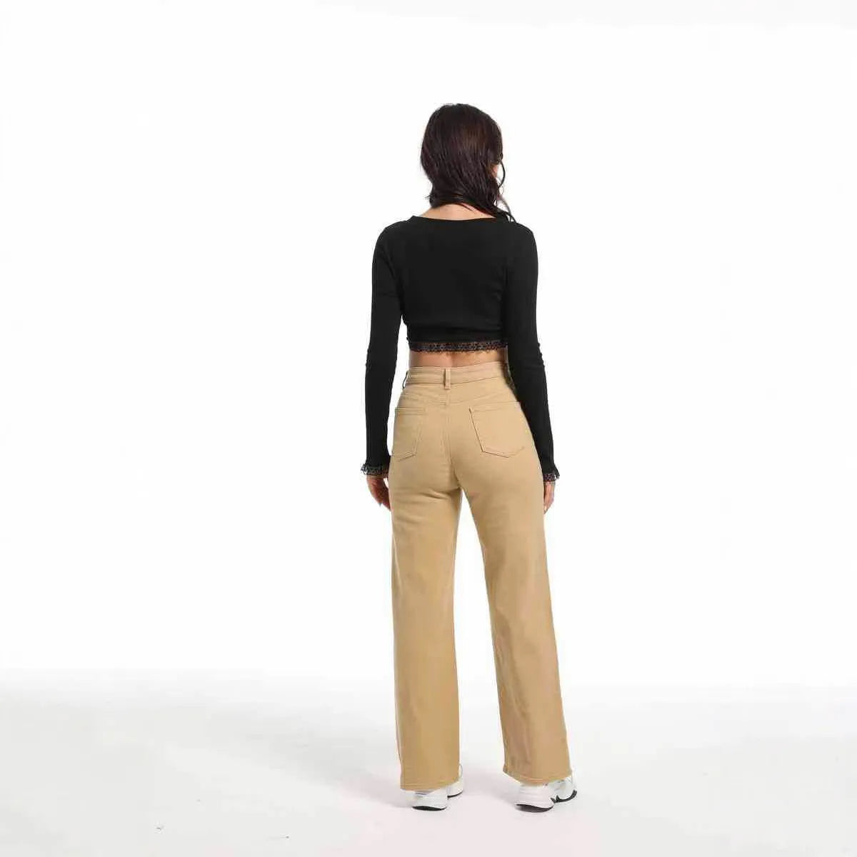 Women's high-waisted straight leg jeans in apricot colour, showing wide leg and elastic cotton fabric.