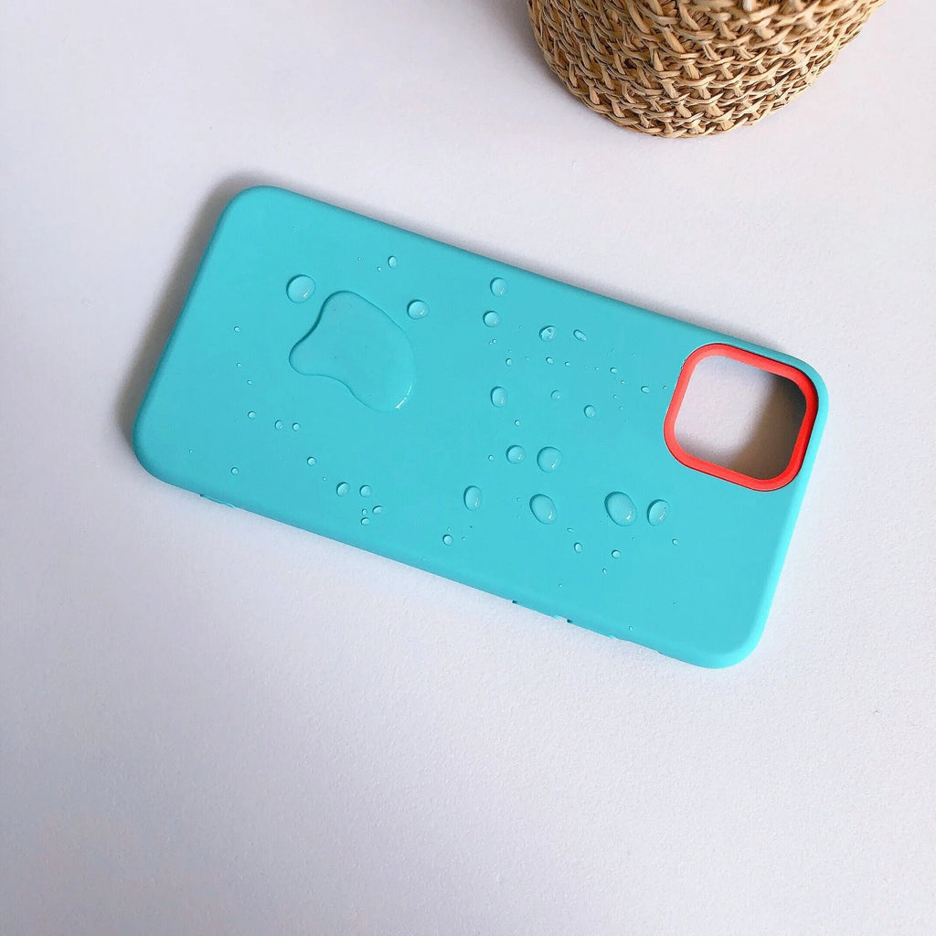 Silicone mobile phone case with macaron cartoon pattern in pink, fitted on an iPhone