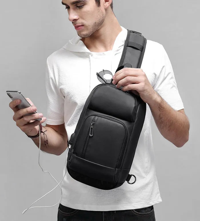 Black medium outdoor leisure shoulder bag showing square shape and single air cushion strap