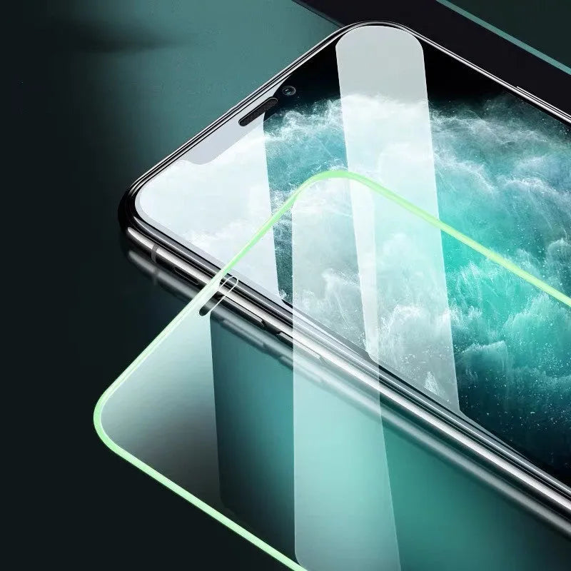 Luminous full cover tempered glass screen protector glowing softly next to an iPhone.