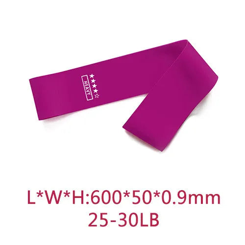 Five pink gradient latex yoga tension bands laid flat showing increasing resistance levels from light pink to rose red