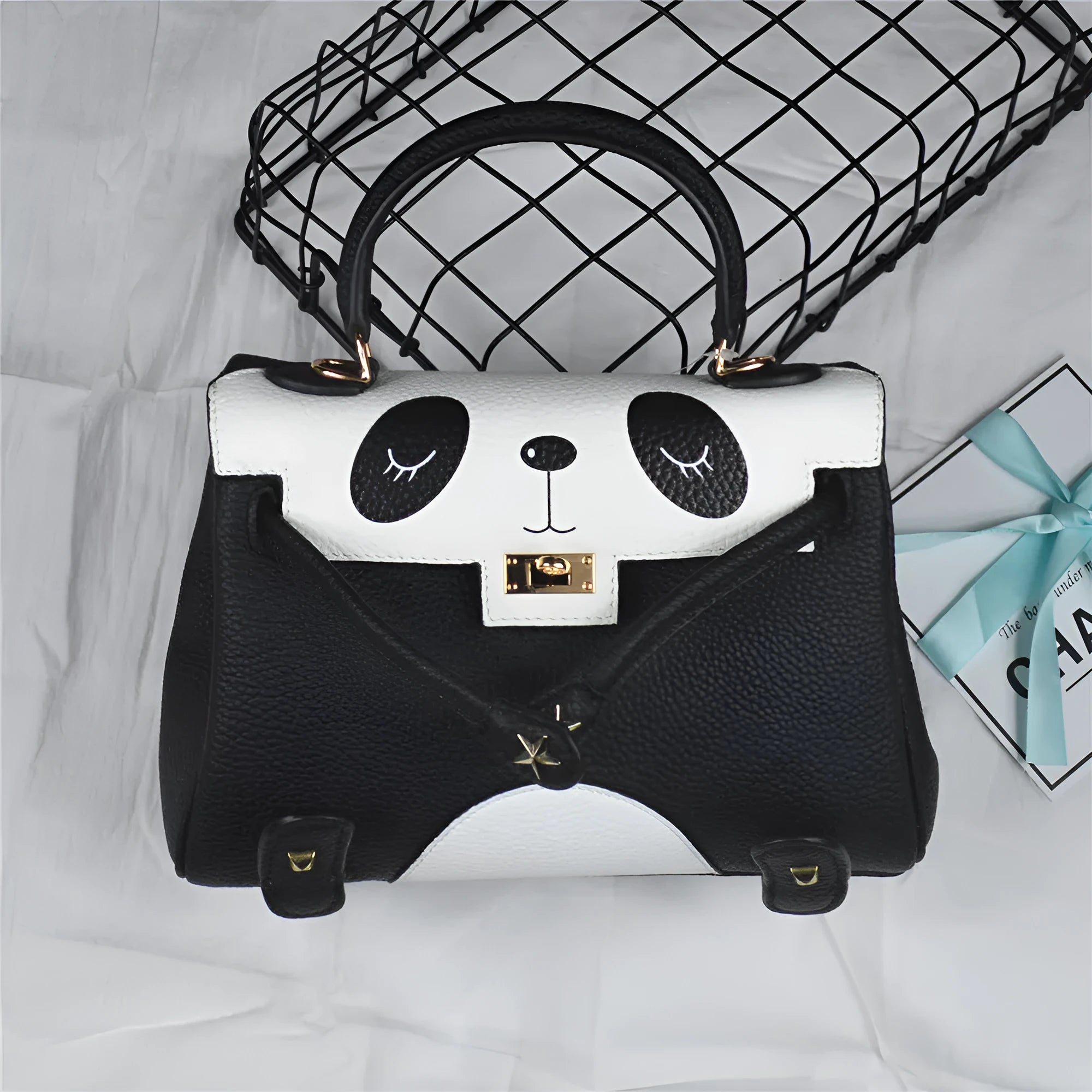 Panda print leather handbag with horizontal square shape, shown in two size options.