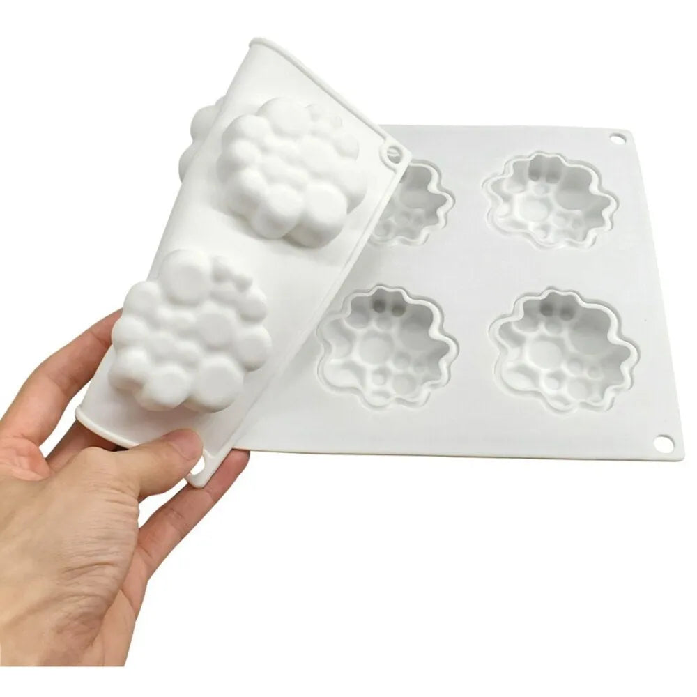 Round silicone cake mould with bubble tower pattern showing 8 raised decorative bubbles