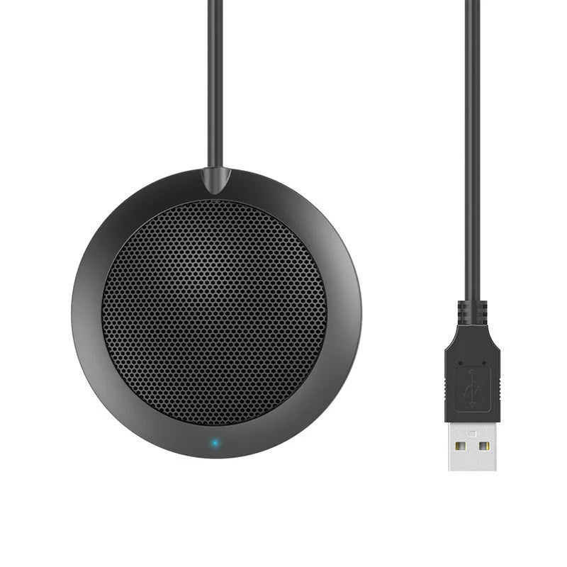 Black USB desktop microphone with metal mesh cover and zinc alloy shell on a computer desk
