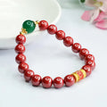 Cinnabar bracelet with engraved six-word motto and 8mm beads in emperor sandstone colour
