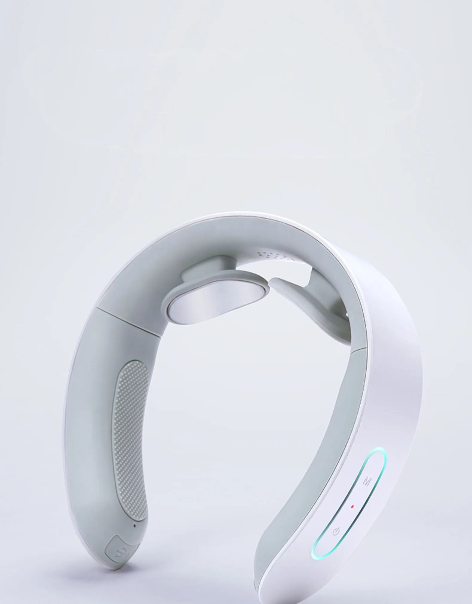 White electric full body acupressure massager with stainless steel nodes on a grey background.