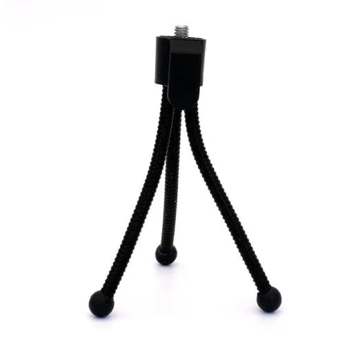 Small black iron mini tripod with ball head, shown folded to 110mm next to a smartphone.