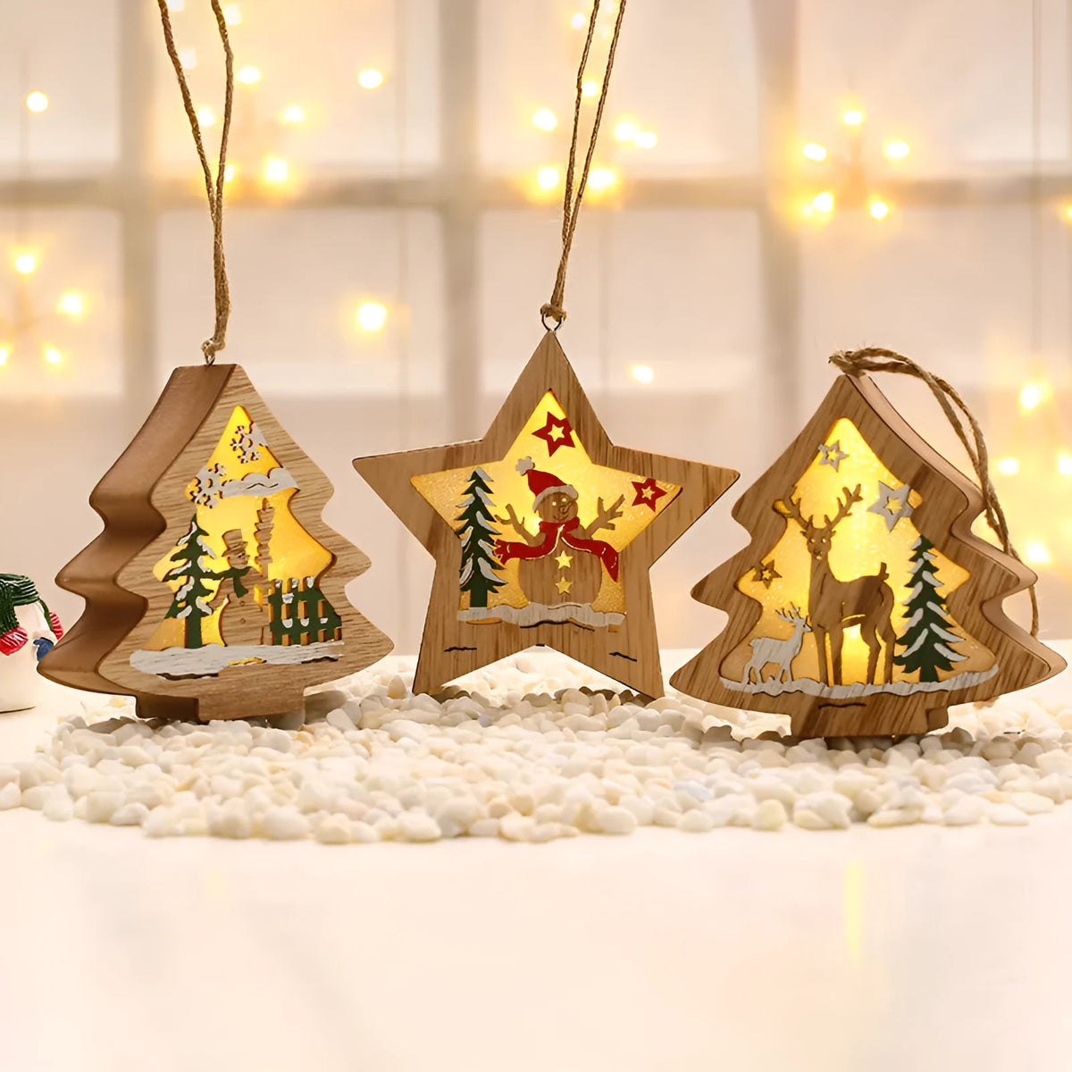 Set of laser-cut wooden Christmas tree decorations with polychromatic finish showing old man, snowman, deer, and star shapes