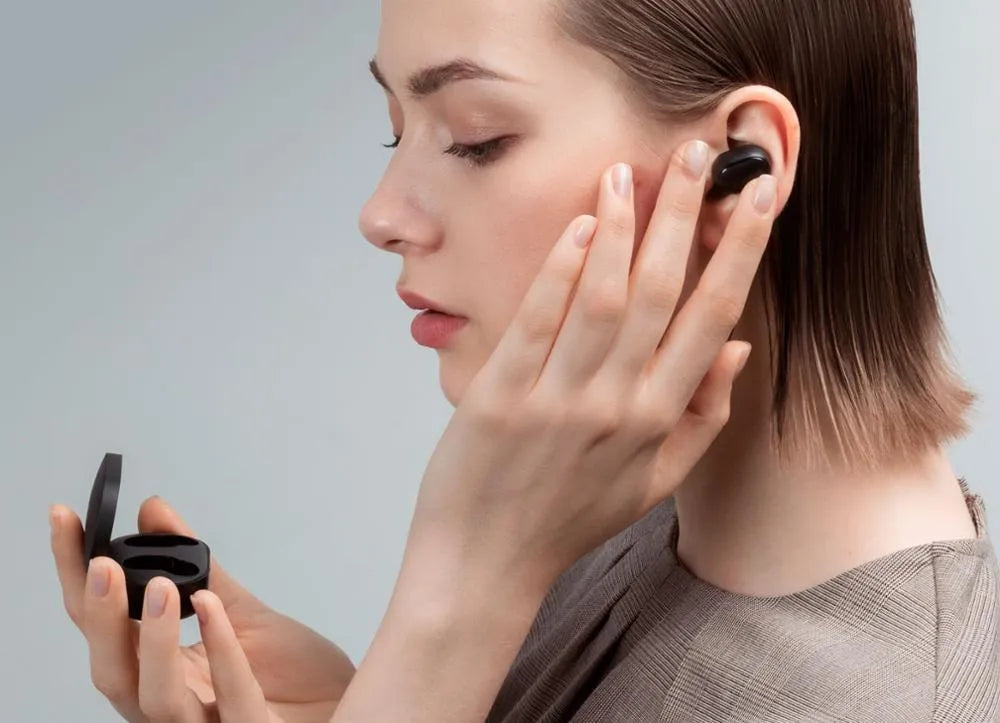 Redmi AirDots 2 black true wireless earphones and charging case on a white background.
