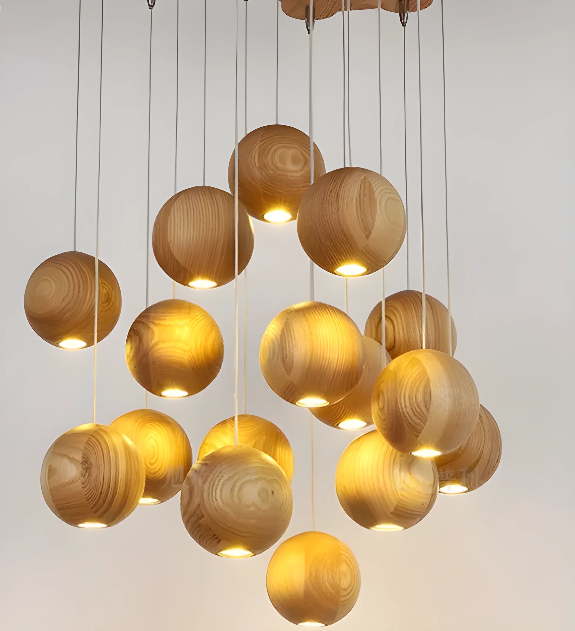 Nordic solid wood ball pendant chandelier with an adjustable cord hanging from a wooden disc.