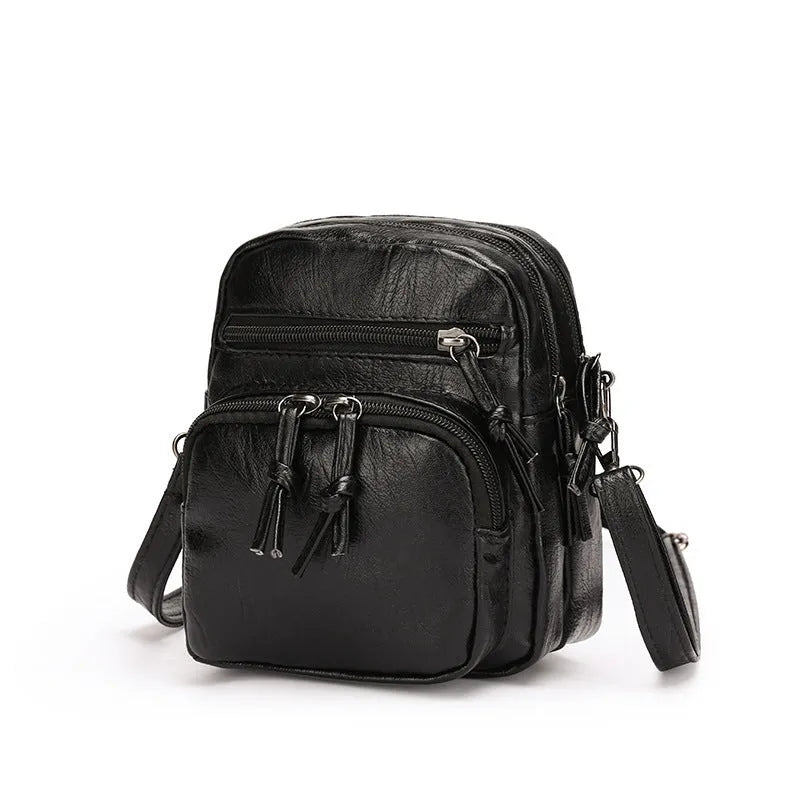 Women's soft PU leather mini shoulder bag with chain strap, square vertical shape, plain black finish, zipper closure