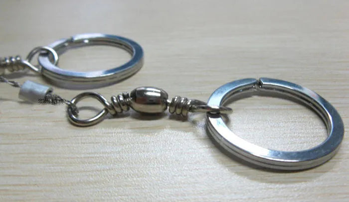 Stainless steel survival wire saw with pull rings showing 55cm cutting blade and extended 70cm total length