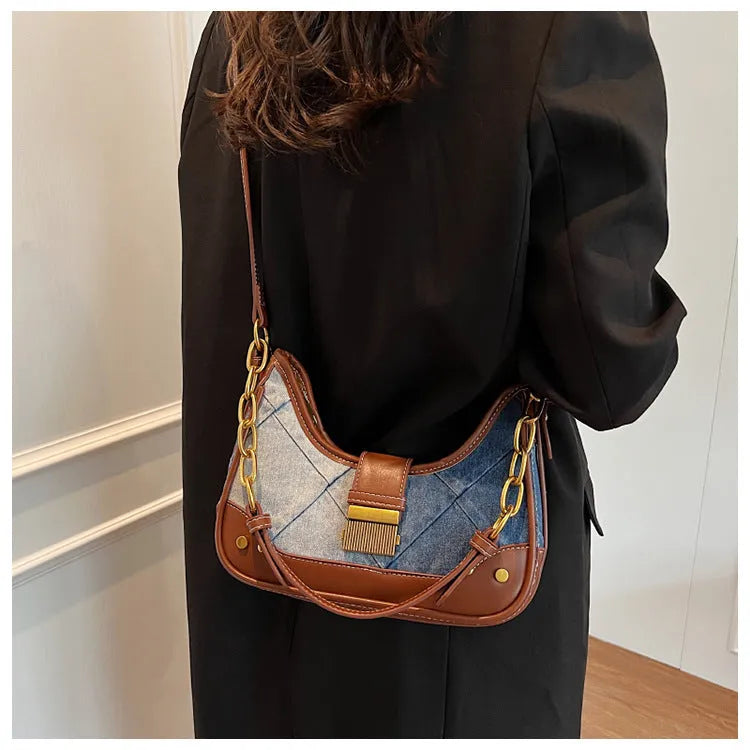 Brown soft denim women's shoulder bag with diamond mesh and chain details, showing bucket shape.