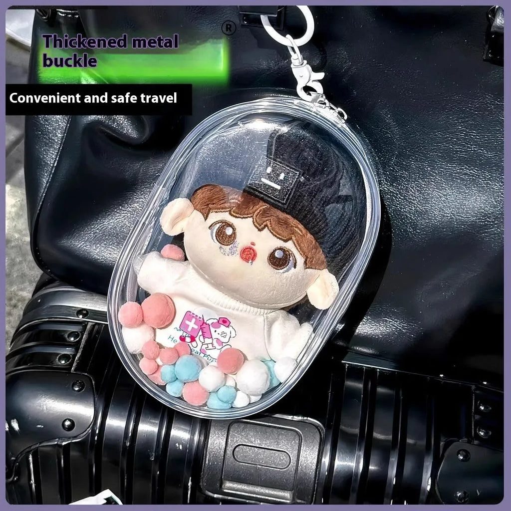 Clear PVC cube-shaped storage bag with colourful ball keychain for cotton dolls and collectibles.