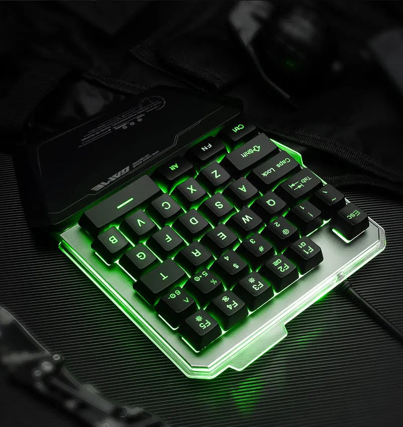 Black G40 Flow one-handed mechanical keyboard with RGB backlit keys on a desk.