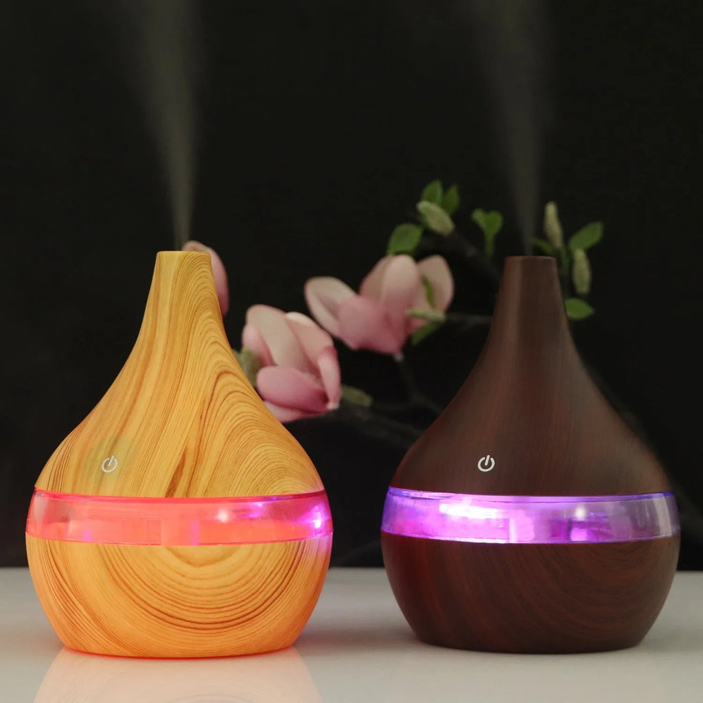 Columnar USB mini air purifier and humidifier in wood grain finish on a desk