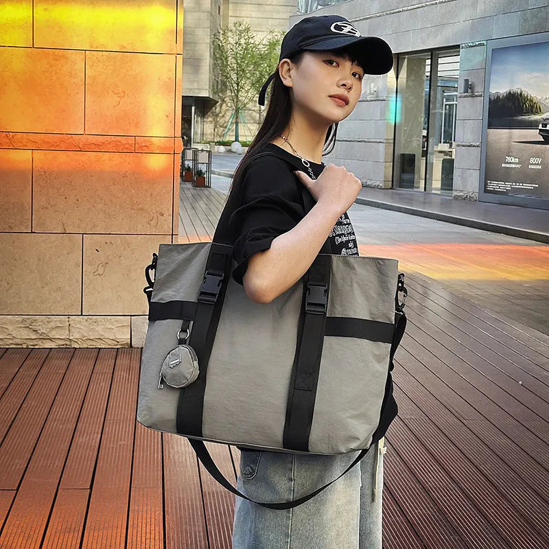 Grey Oxford cloth men's travel shoulder bag with separate coin purse showing large capacity design