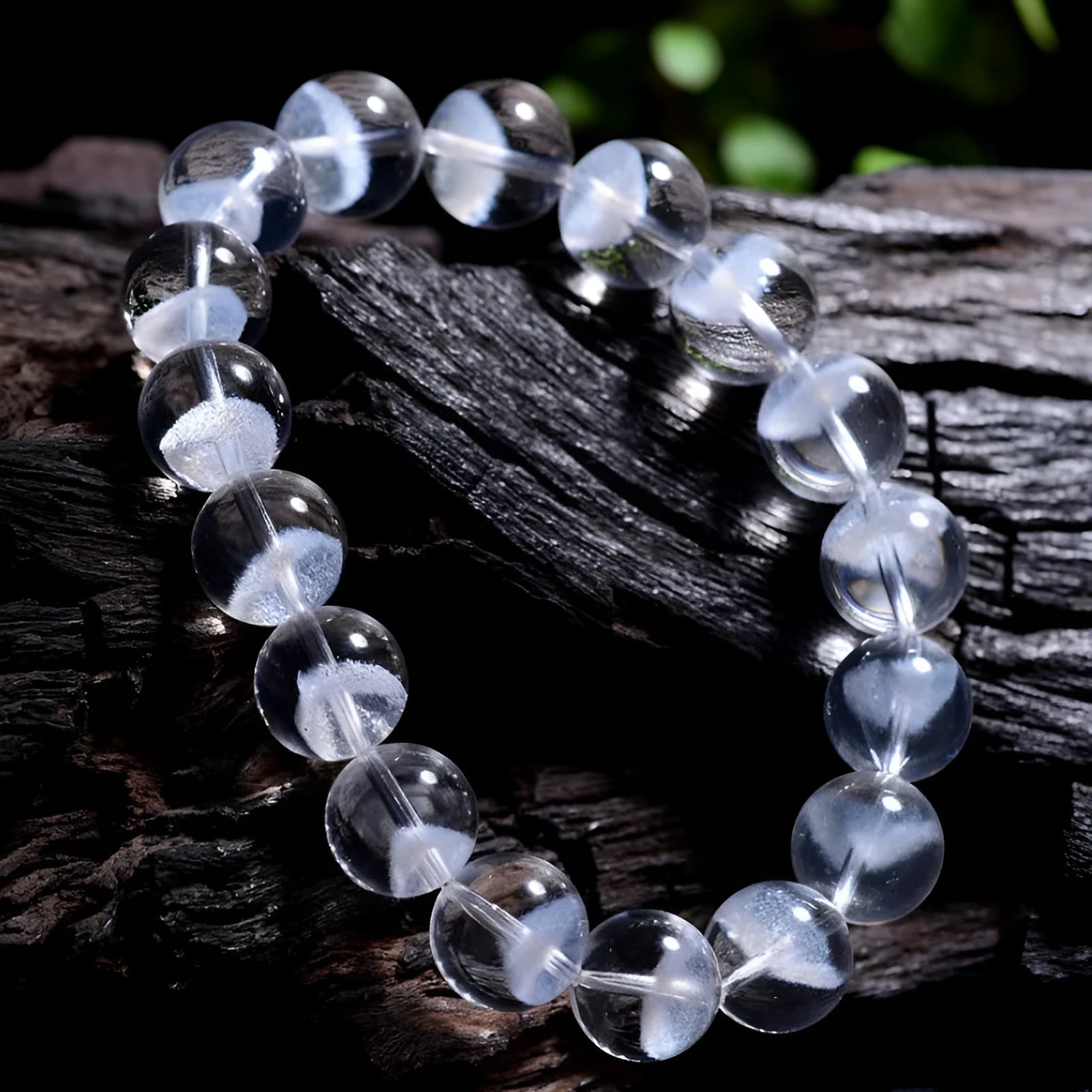 Women's natural white crystal bracelet with a pyramid charm and ruyi charm, showing spherical beads.