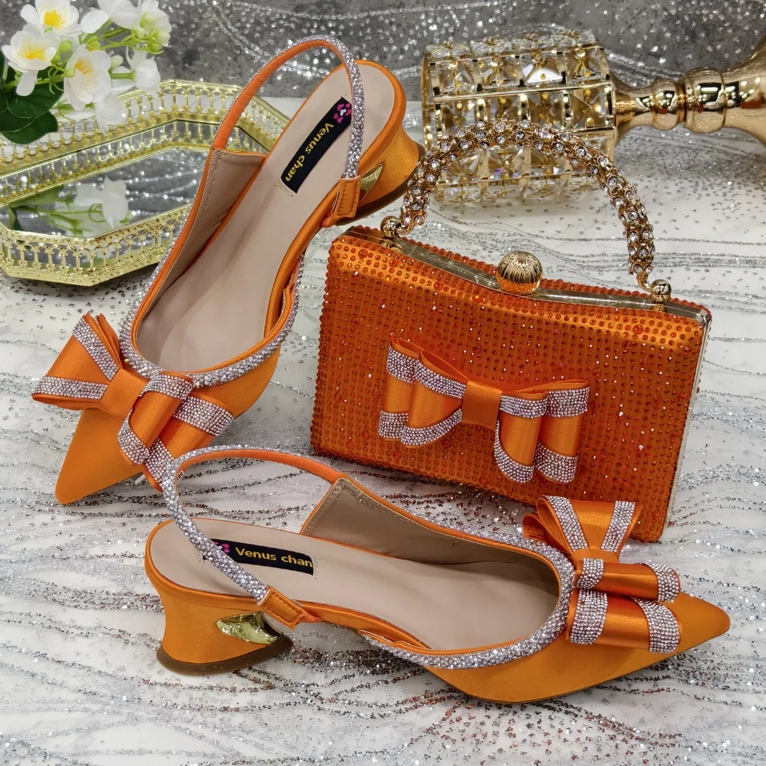 Women's pointed toe sandals with rhinestones and matching square bag in wine red colour