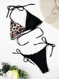 Women's leopard print bikini swimsuit with halter neck and lace-up front design