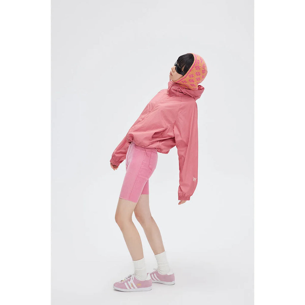 Men's thin hooded sports coat in chemical fibre blend on a hanger.