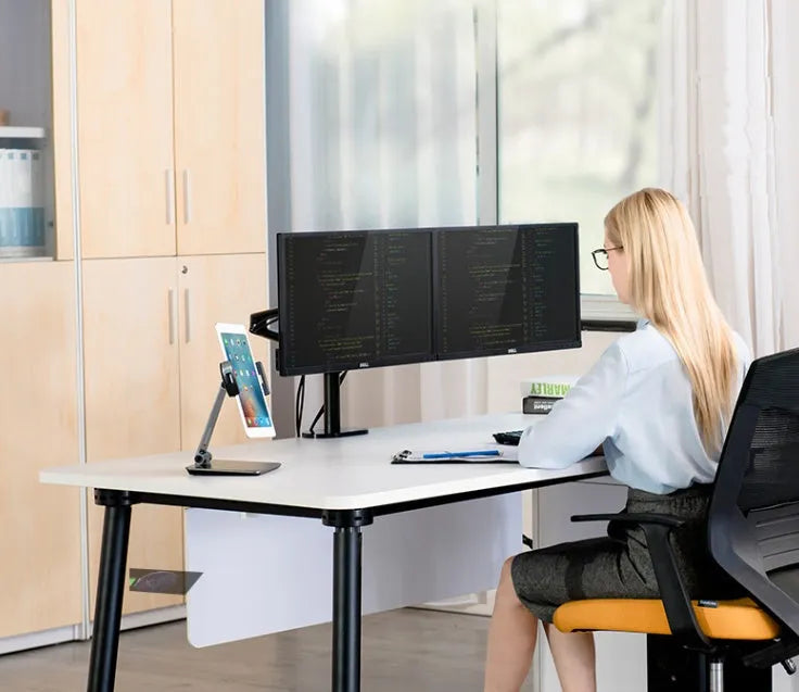Foldable aluminium desktop stand holding a tablet at an angle.