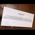 Apple white metal Bluetooth wireless keyboard with ultra-thin design and multimedia function keys