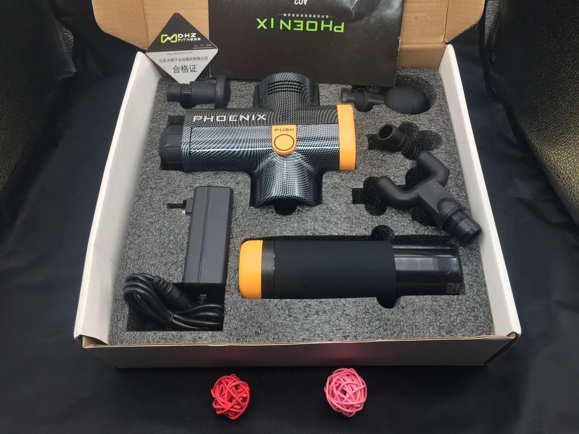 Fascia massage gun with four interchangeable heads in black finish