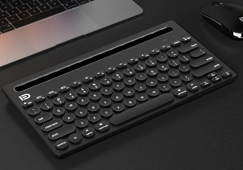 Wireless Bluetooth keyboard in black and pink colours, ultra-slim 22mm profile, compact 297x178mm size for home and office use