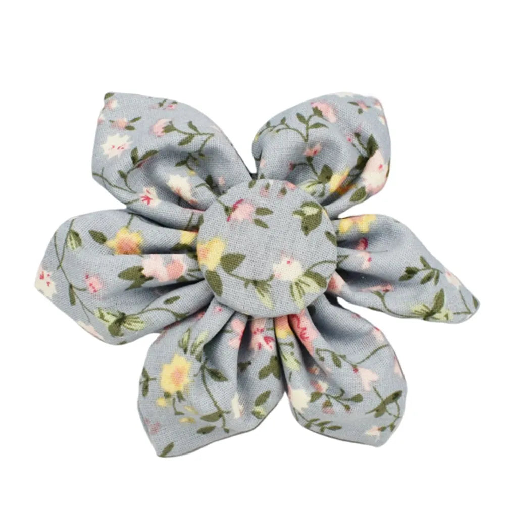 Blue floral dog collar and matching leash, bow, vest, and waste bag holder five-piece pet set.