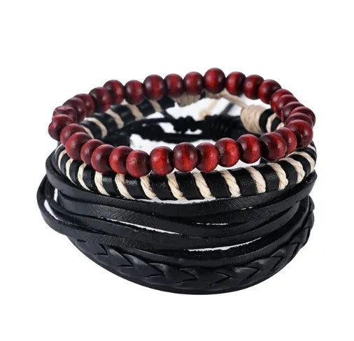 Handmade brown leather wrap bracelet with wooden beads and braided cord on a wrist.