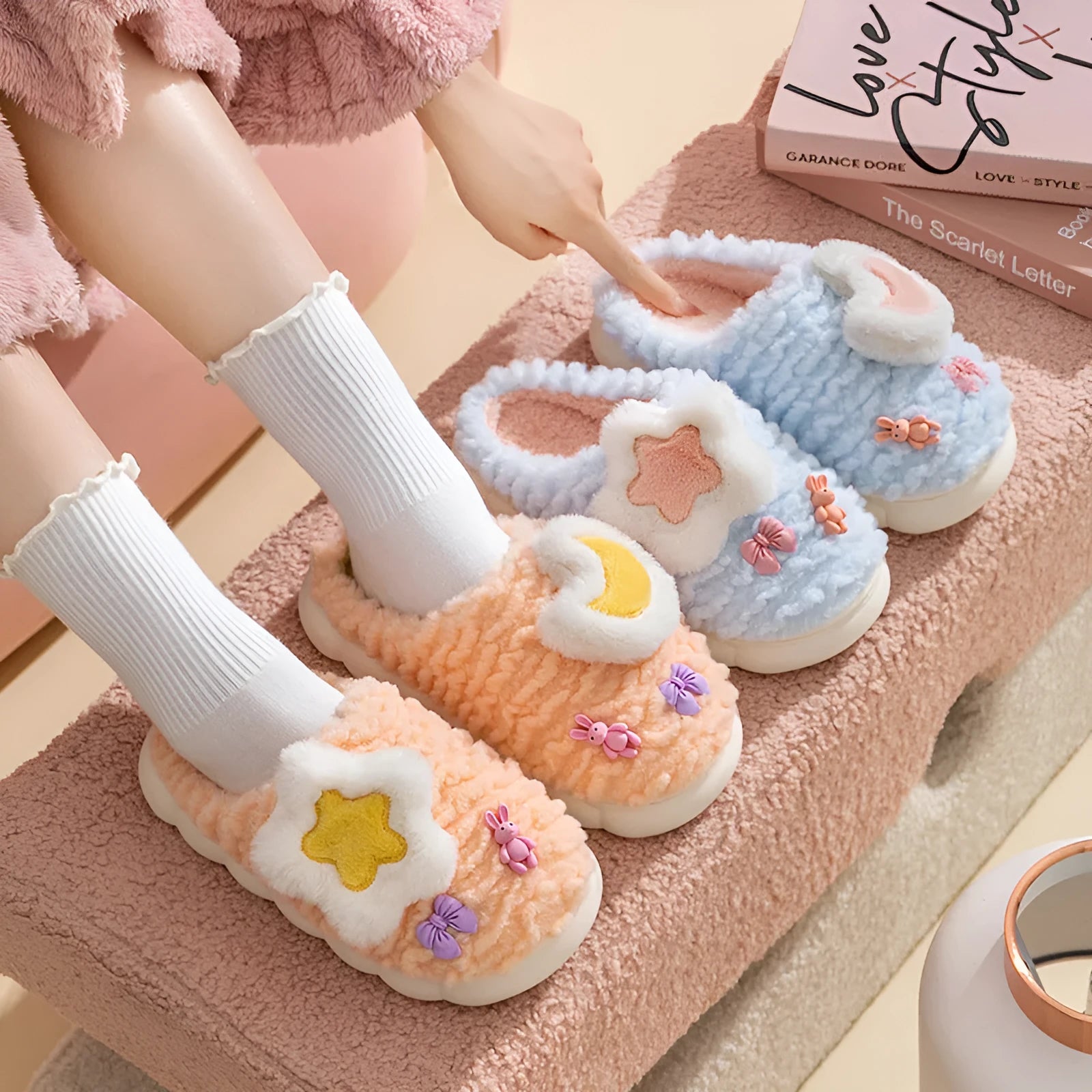 Light blue women's plush slippers with an animal pattern on the round toe holder and a thick fleece lining.