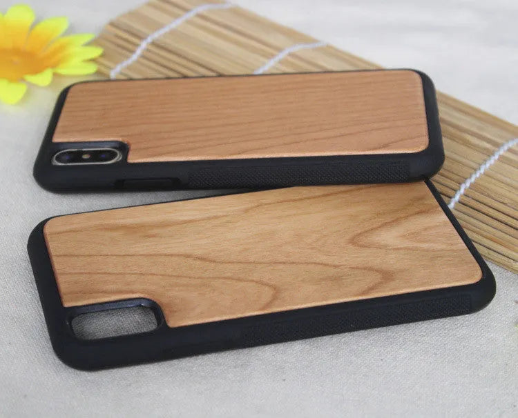 Wooden iPhone case with carbonised bamboo back and black TPU bumper on an iPhone.